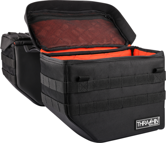Black Thrasin Supply Co. Expedition Saddlebags for motorcycles, featuring durable storage with secure straps and rugged design.