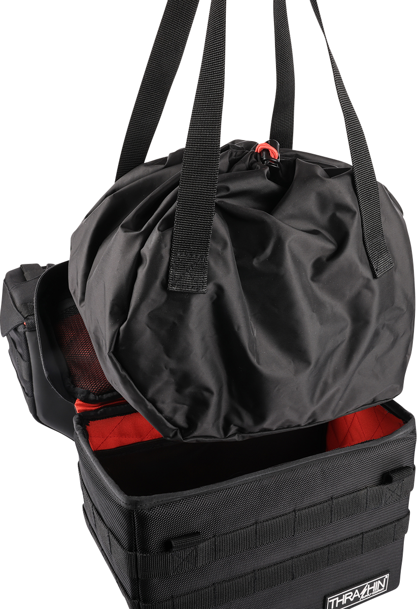 Black THRASHIN SUPPLY CO. Expedition Saddlebags for motorcycles, featuring durable storage with secure straps and rugged design.