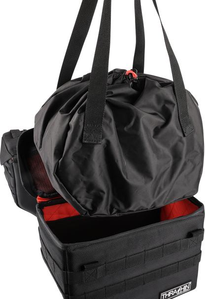 Black THRASHIN SUPPLY CO. Expedition Saddlebags for motorcycles, featuring durable storage with secure straps and rugged design.