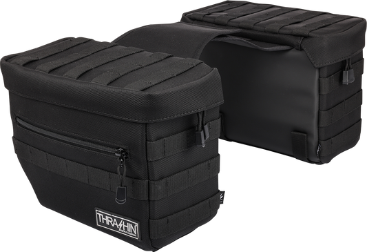 Black THRASHIN SUPPLY CO. Essential Saddlebags with 10-liter capacity, mounted on motorcycle, durable storage solution