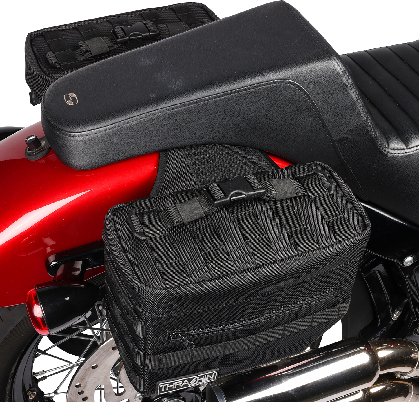 Black THRASHIN SUPPLY CO. Essential Saddlebags with 10-liter capacity, designed for motorcycle storage and durability.