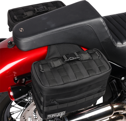Black THRASHIN SUPPLY CO. Essential Saddlebags with 10-liter capacity, designed for motorcycle storage and durability.
