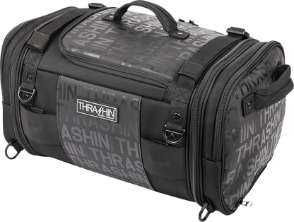 THRASHIN SUPPLY CO. motorcycle passenger bag with 32L capacity, versatile mounting options, shown mounted on a motorcycle seat.