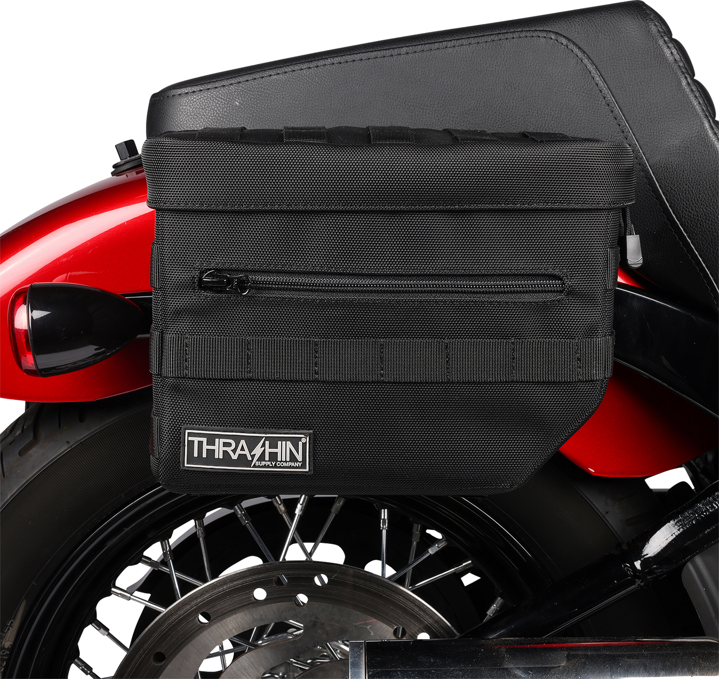 Black THRASHIN SUPPLY CO. Essential Saddlebags with 10-liter capacity, designed for motorcycle storage and durability.