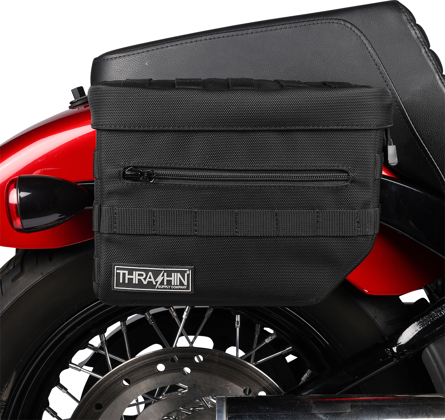 Black THRASHIN SUPPLY CO. Essential Saddlebags with 10-liter capacity, designed for motorcycle storage and durability.