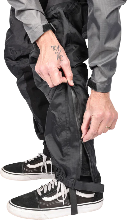 Black THRASHIN SUPPLY CO. Mission Rain Pants in size S/M, shown with waterproof fabric and adjustable waistband.