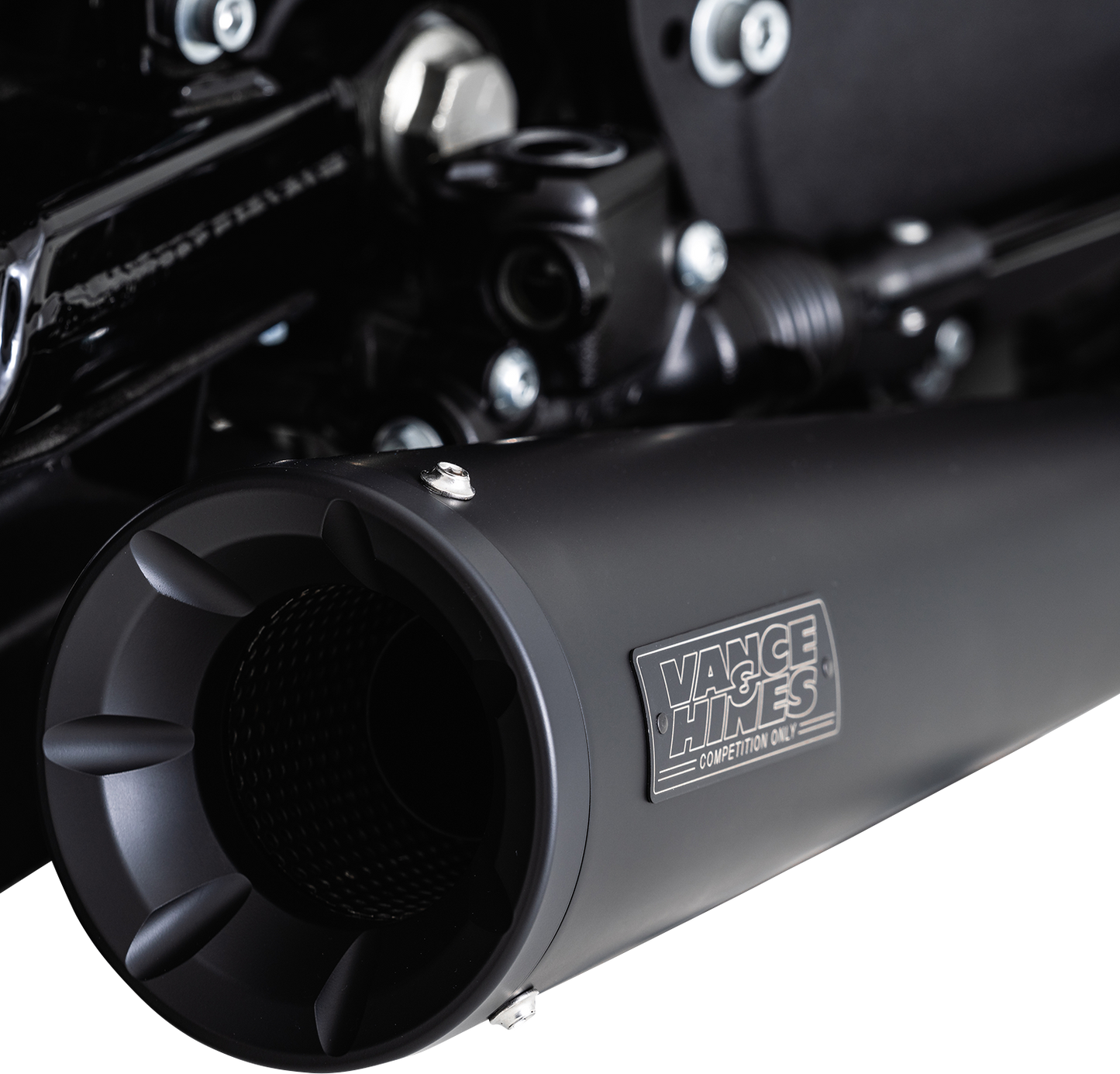 Vance & Hines Upsweep 2-into-1 motorcycle exhaust system with black finish, featuring sleek, curved pipes and chrome accents.