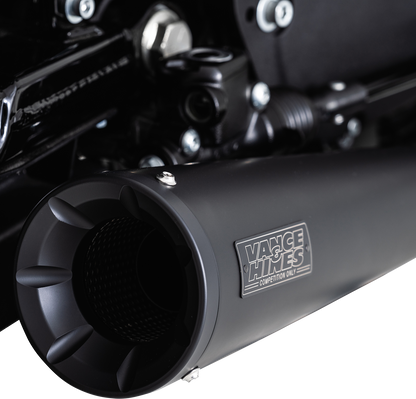 Vance & Hines Upsweep 2-into-1 motorcycle exhaust system with black finish, featuring sleek, curved pipes and chrome accents.