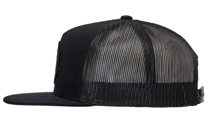 Alpinestars Bolt Trucker Hat in black with mesh back and adjustable strap, featuring the ALPINESTARS logo on front.