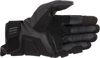 Alpinestars Phenom Air gloves in black and white, medium size, featuring breathable mesh and protective padding for riding comfort.
