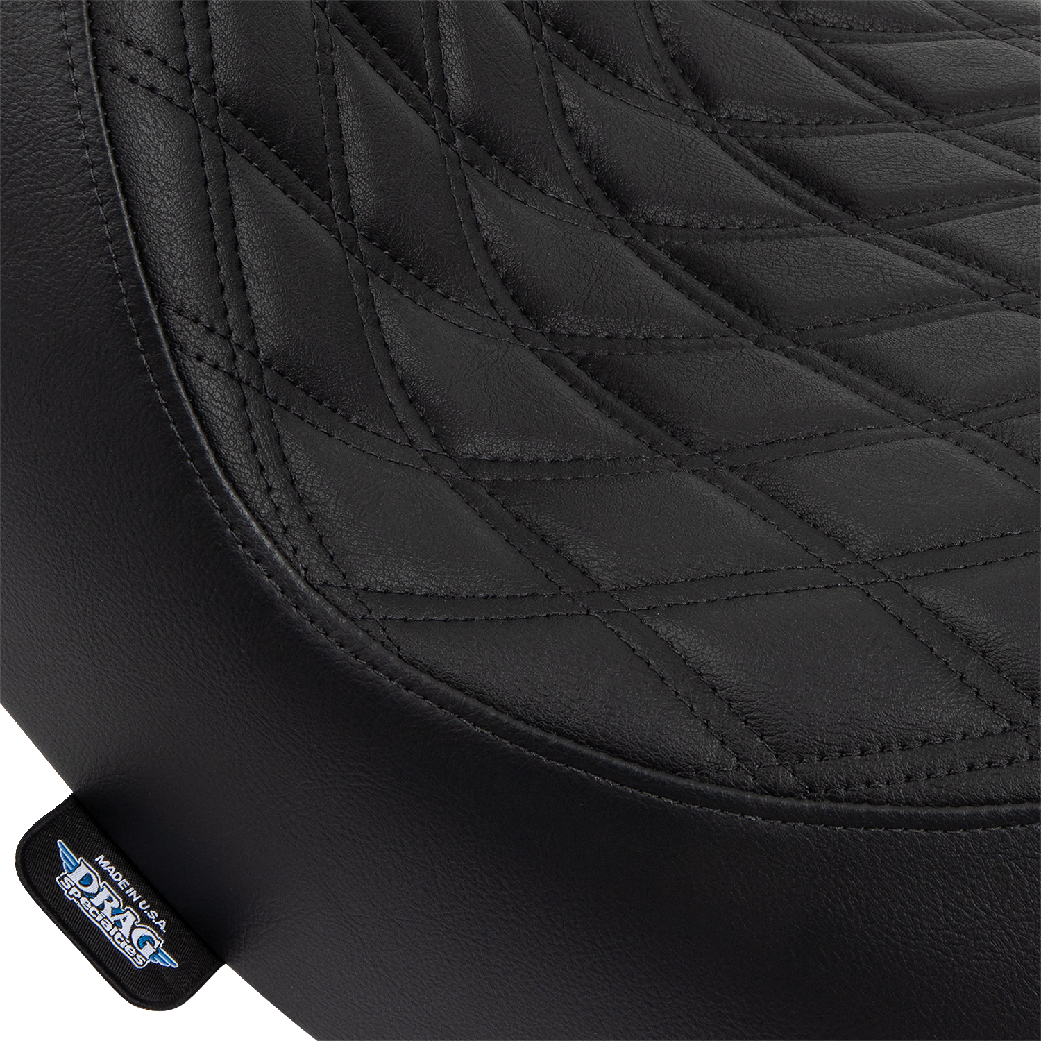 Black double diamond solo seat for FL/FX motorcycles by Drag Specialties with black stitching, model 0802-1513.