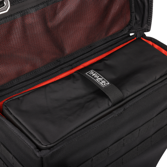 Black THRASHIN SUPPLY CO. Cooler Expedition Bag TSB-0012 with sturdy handles and zip closure, designed for outdoor use.