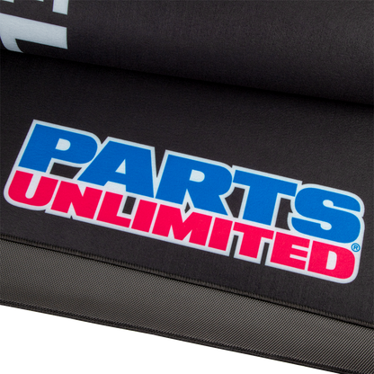 Large PARTS UNLIMITED absorbent pit pad with logo, designed for shop and pit area protection, shown in the image.