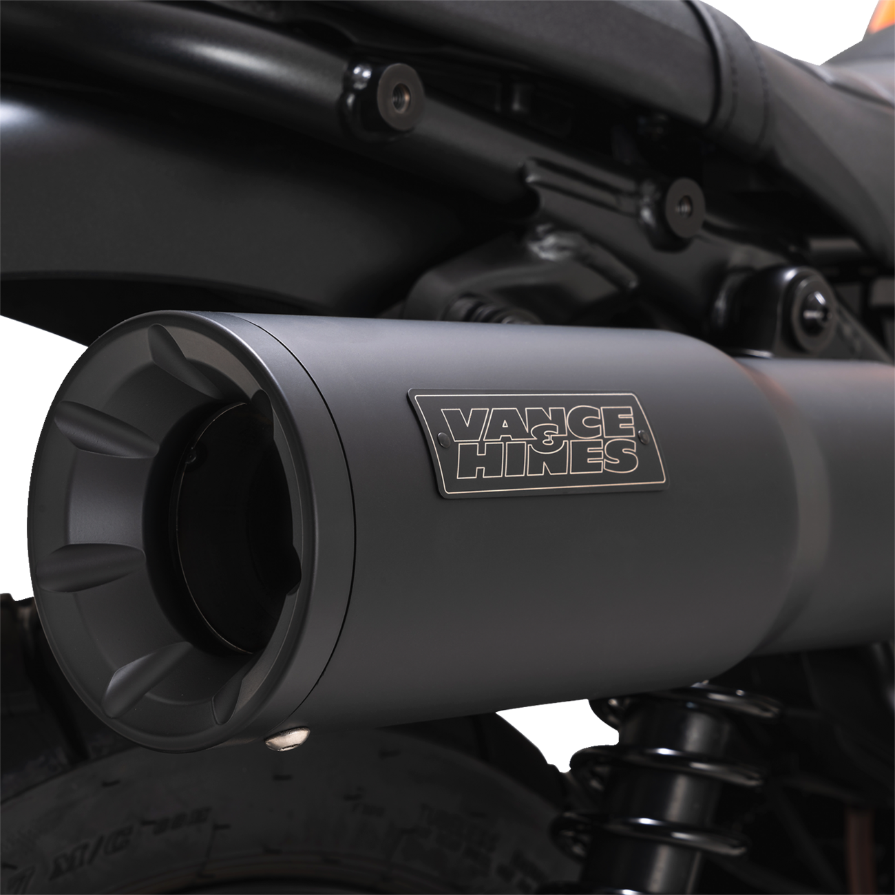 VANCE & HINES Hi-Output Slip-On Muffler for motorcycles, shiny chrome finish with sleek design and exhaust pipe connections.