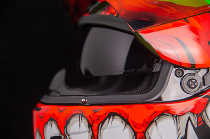 Red ICON Airform™ motorcycle helmet in medium size with Manik'R design, featuring a sleek, aerodynamic shell and clear visor.
