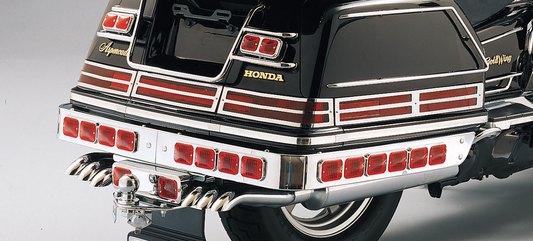 Parts Unlimited chrome saddlebag lens grille set for Honda GL1500 motorcycle, includes two decorative lens covers.
