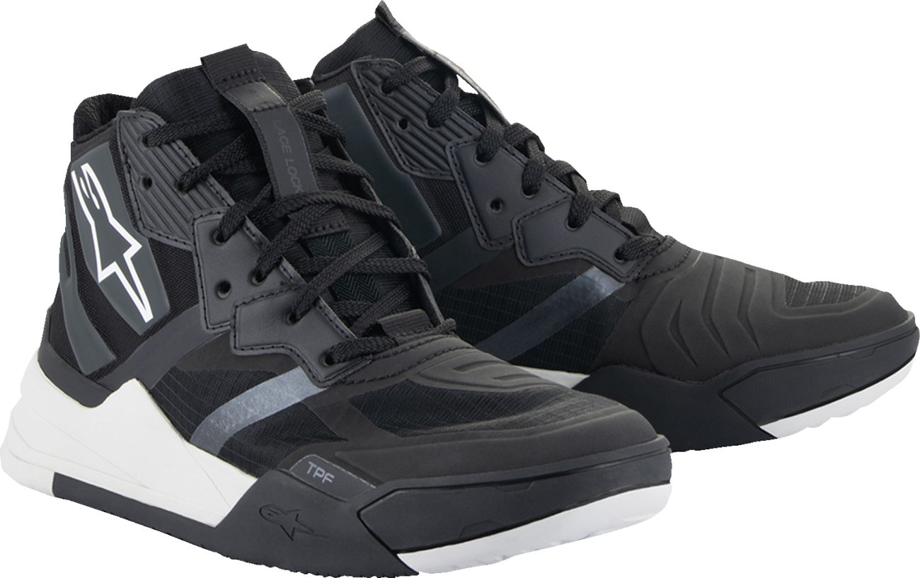 Alpinestars Speedflight performance riding shoe in black and white, US 9.5, featuring sleek design and durable racing-inspired materials.