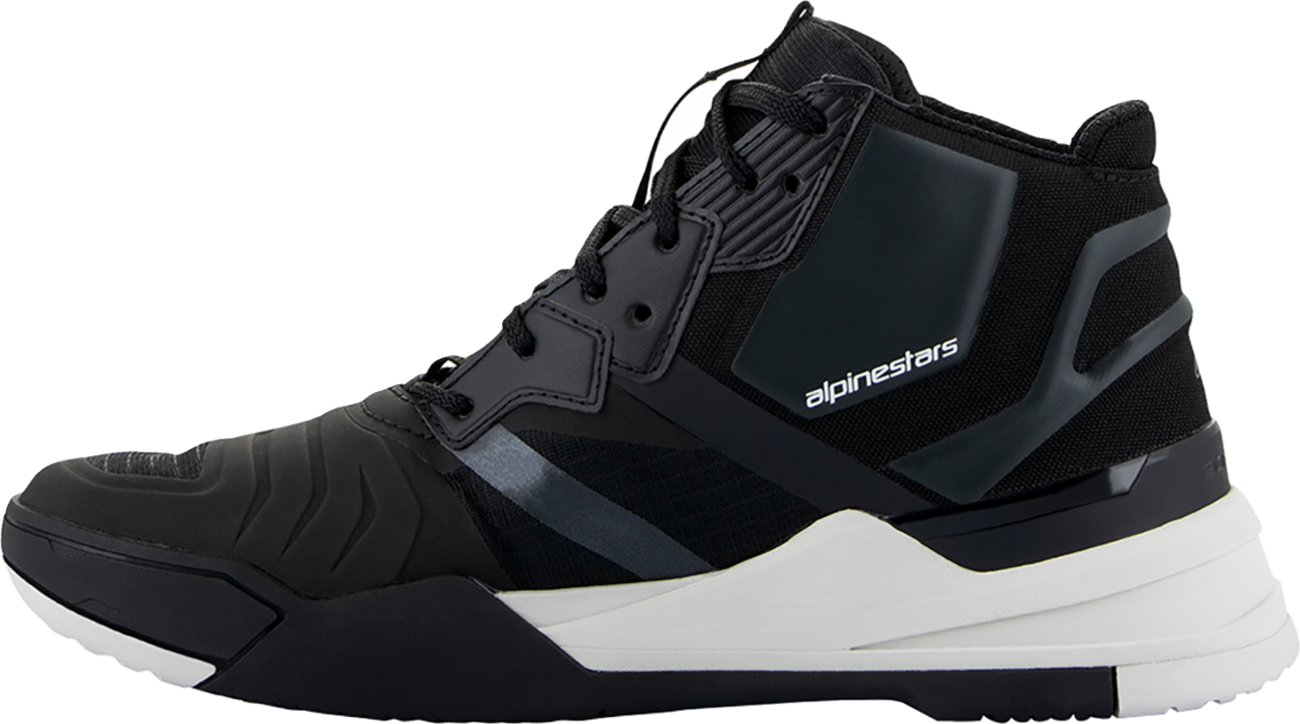 Alpinestars Speedflight performance riding shoe in black and white, US size 14, showing sleek motorcycle footwear design.