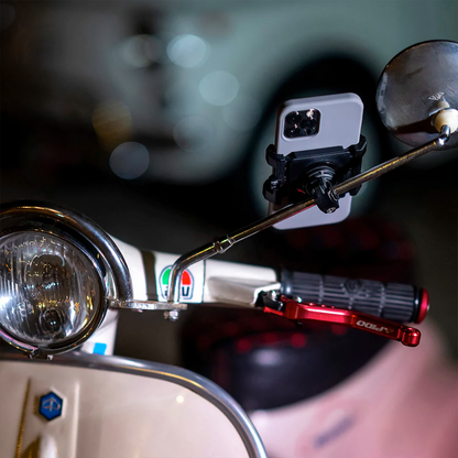 Universal SP CONNECT clamp for phones by Bill's Exhausts, shown securing a phone in a sleek, black mounting device.