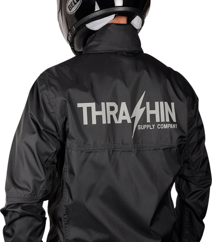 Black THRASHIN SUPPLY CO. Mission WP rain jacket in medium size, showcasing waterproof material and adjustable hood.