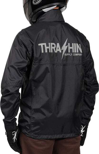 Black THRASHIN SUPPLY CO. Mission WP Rain Jacket in medium size, showcasing waterproof design and durable fabric.