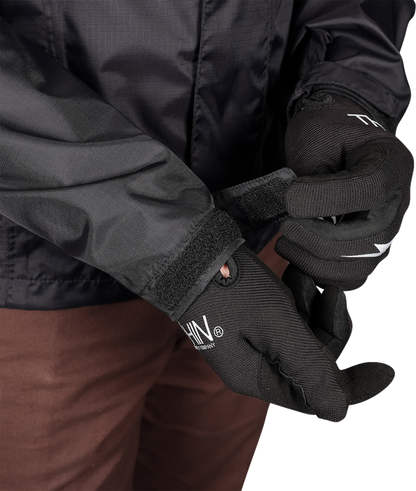 Black THRASHIN SUPPLY CO. Mission WP rain jacket, medium size, showing waterproof fabric and front zipper details.