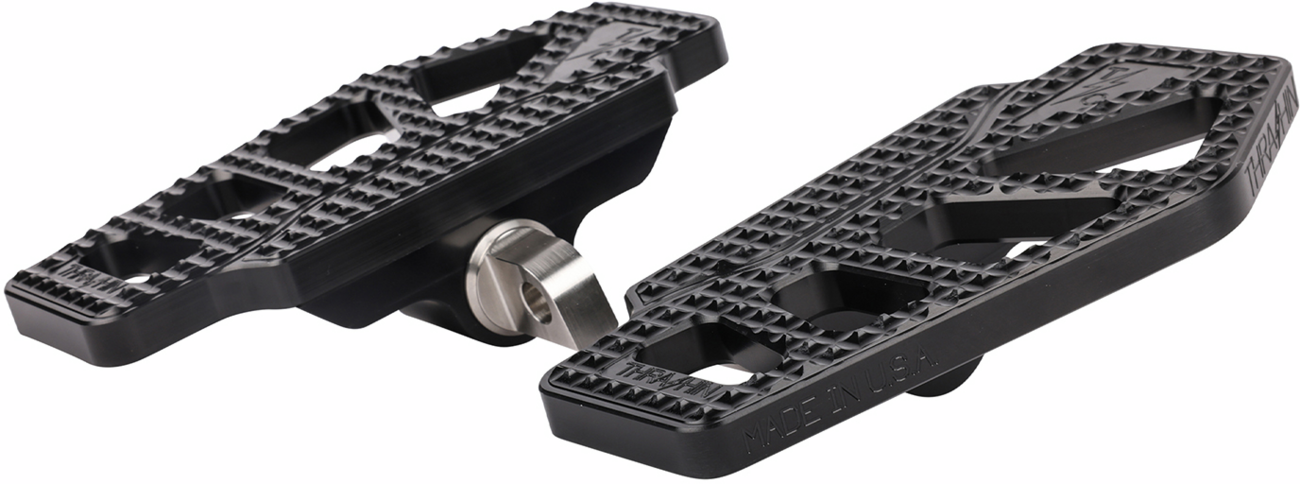 Black THRASHIN SUPPLY CO. Apex Mini Floorboards for drivers, featuring a textured surface and compact design.