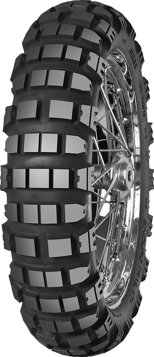 MITAS Enduro Trail-XT+ rear motorcycle tire 110/80-18 for adventure and dual sport bikes, with rugged tread pattern.