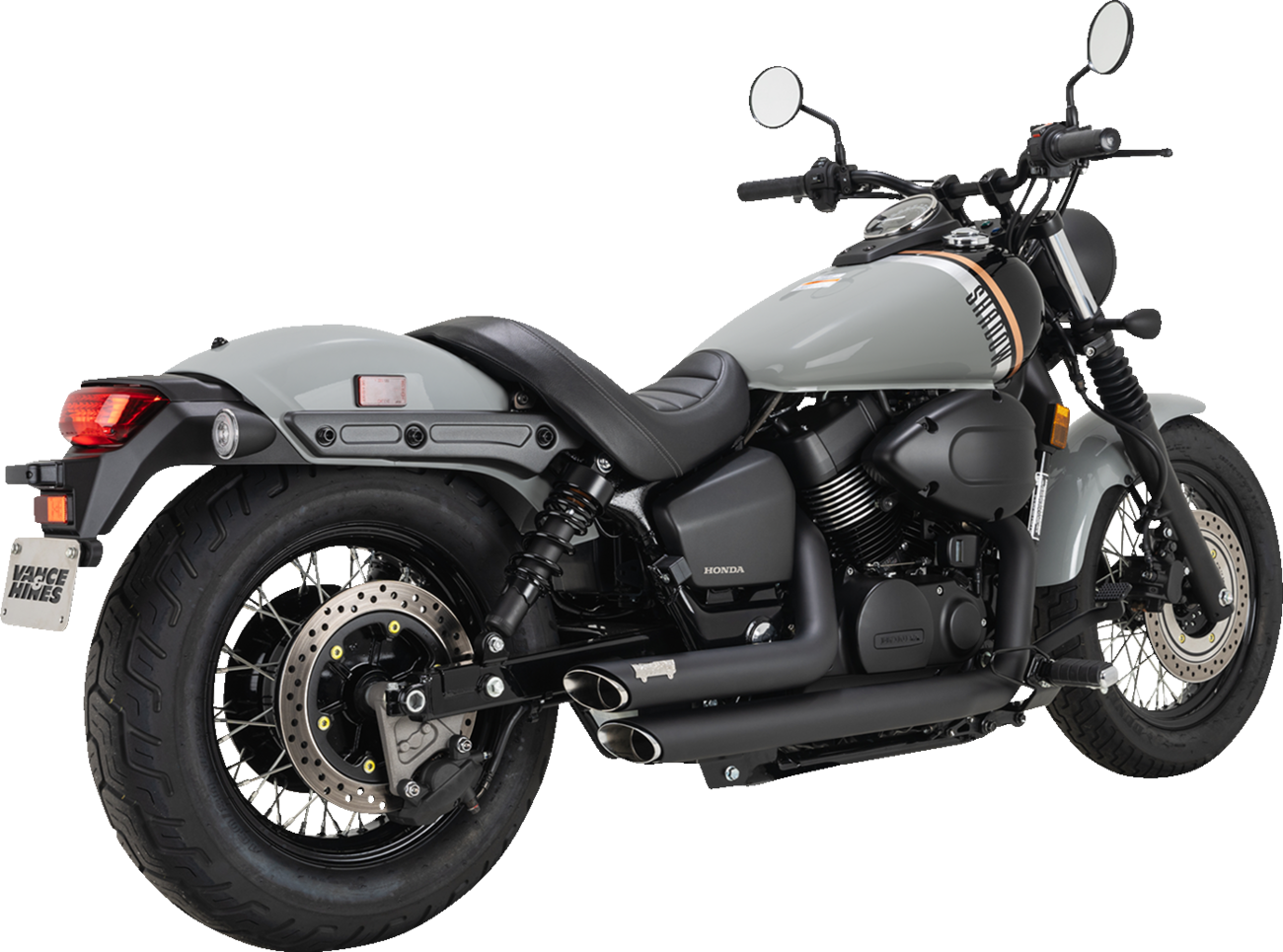 Vance & Hines Shortshots Staggered Black Exhaust System for motorcycle, showcasing sleek black finish and staggered pipe design.