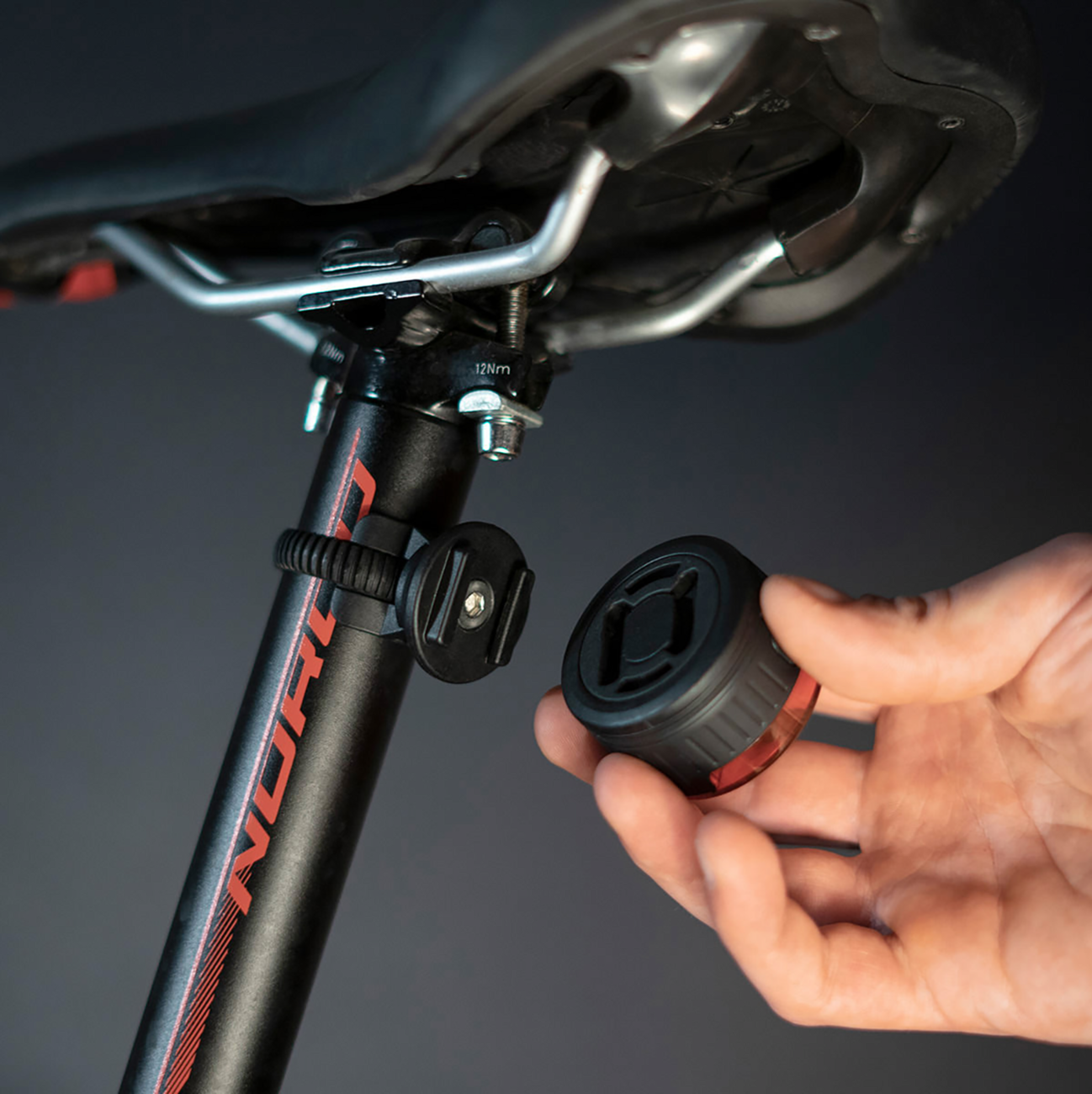 Bill's Exhausts SP CONNECT All-Round LED Safety Light in red showing 100 lumens, designed for phone safety and visibility.