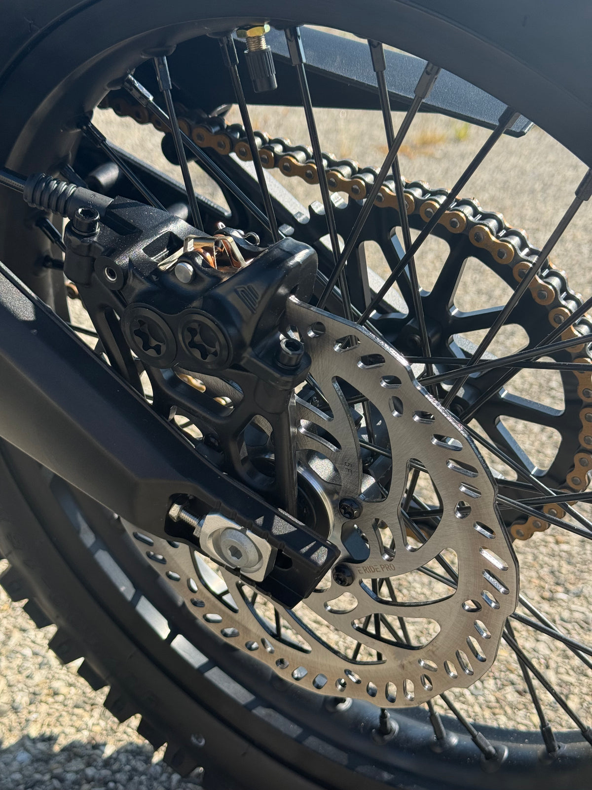 E Ride Pro SR electric dirt bike with 25KW motor, black frame, knobby tires, and sleek design for off-road riding.