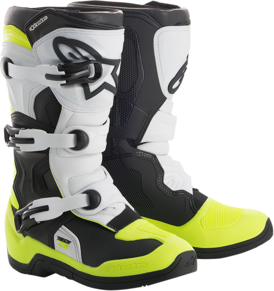 Alpinestars Tech 3S motorcycle boots in black, white, and fluorescent yellow with protective design and branding visible.