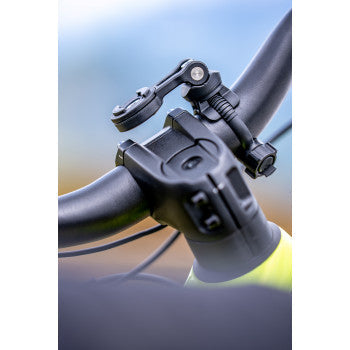 Bill's Exhausts SP CONNECT universal device mount attached to a motorcycle handlebar for secure smartphone mounting.