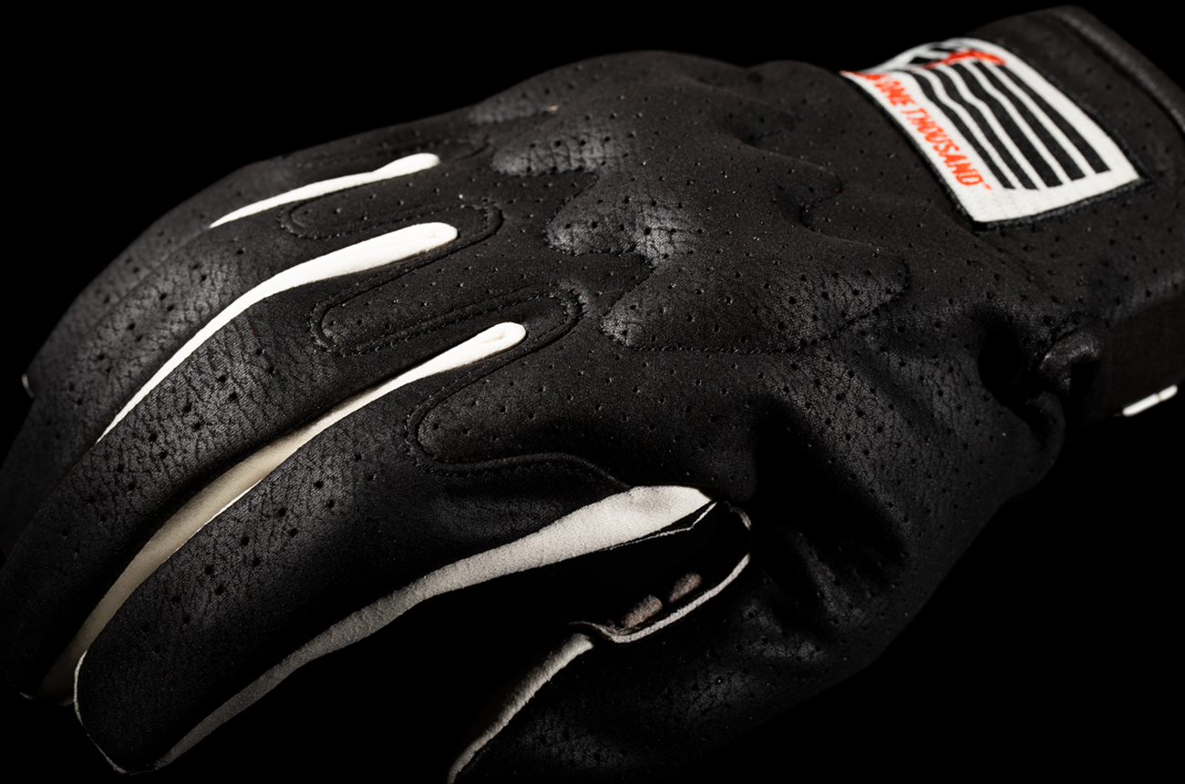 Black ICON Airform Slabtown™ gloves in 2XL size, showcasing the durable motorcycle glove with textured grip and padded knuckles.