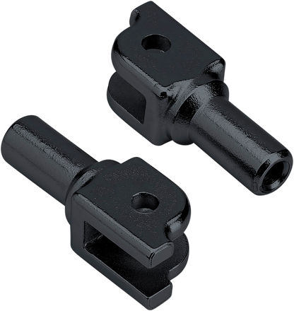 Black Biltwell footpeg mount for Softail motorcycles, shown attached to the bike's body with mounting hardware visible.