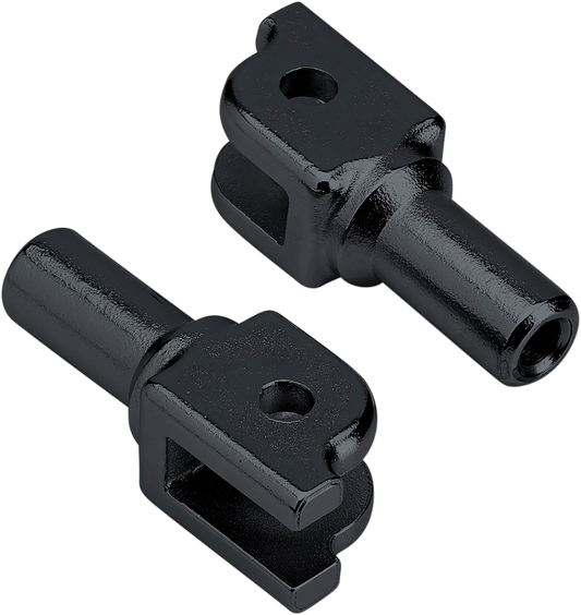 Black Biltwell footpeg mount for Softail motorcycles, shown attached to the bike's body with mounting hardware visible.