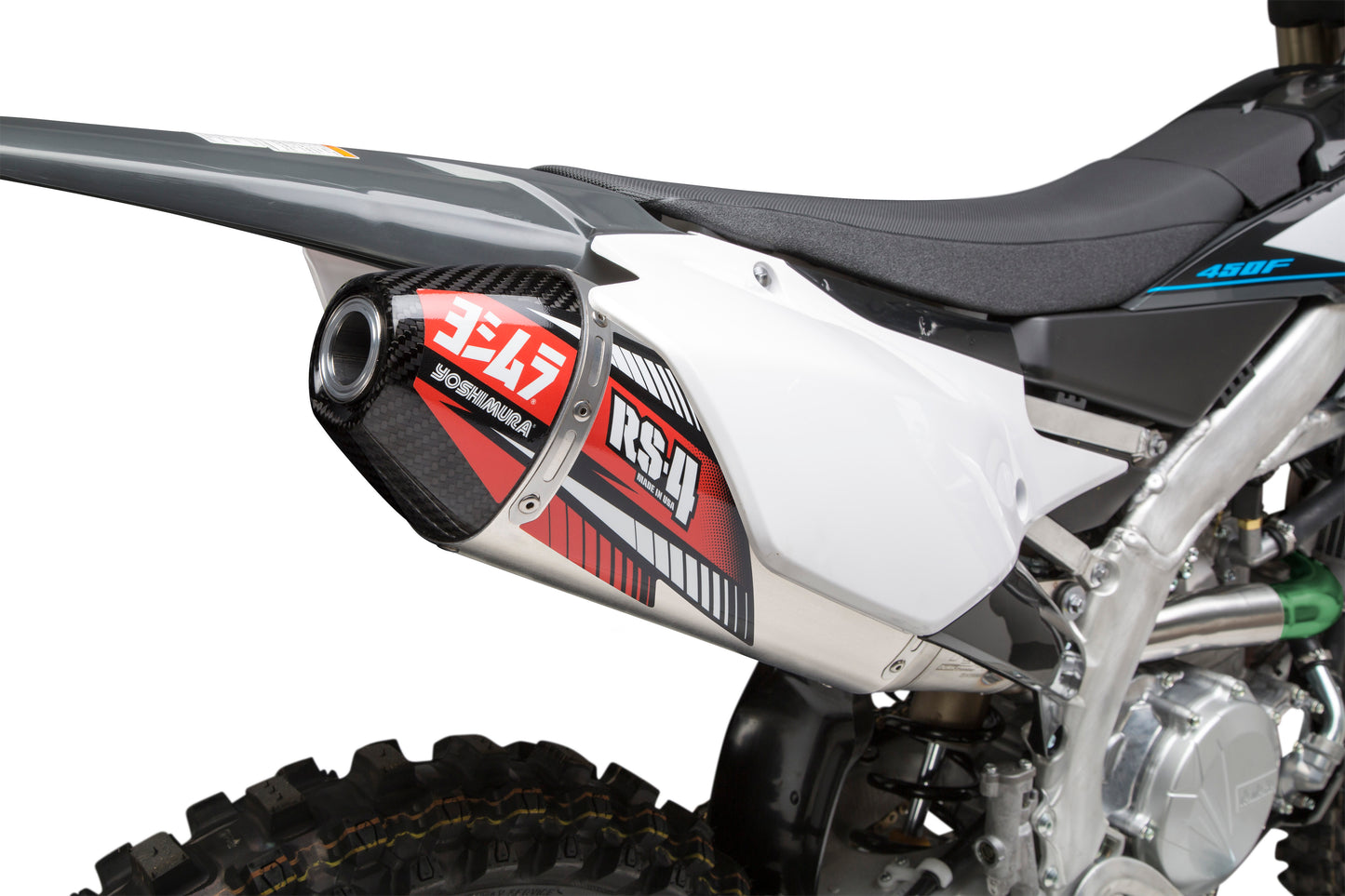 YOSHIMURA RS-4 exhaust slip-on with header, canister, and end cap, showcasing polished metal components for motorcycle performance.