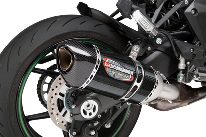 YOSHIMURA RS-12 ADV Street Alpha slip-on exhaust for Kawasaki with matte carbon fiber end cap, showcasing sleek design and branding