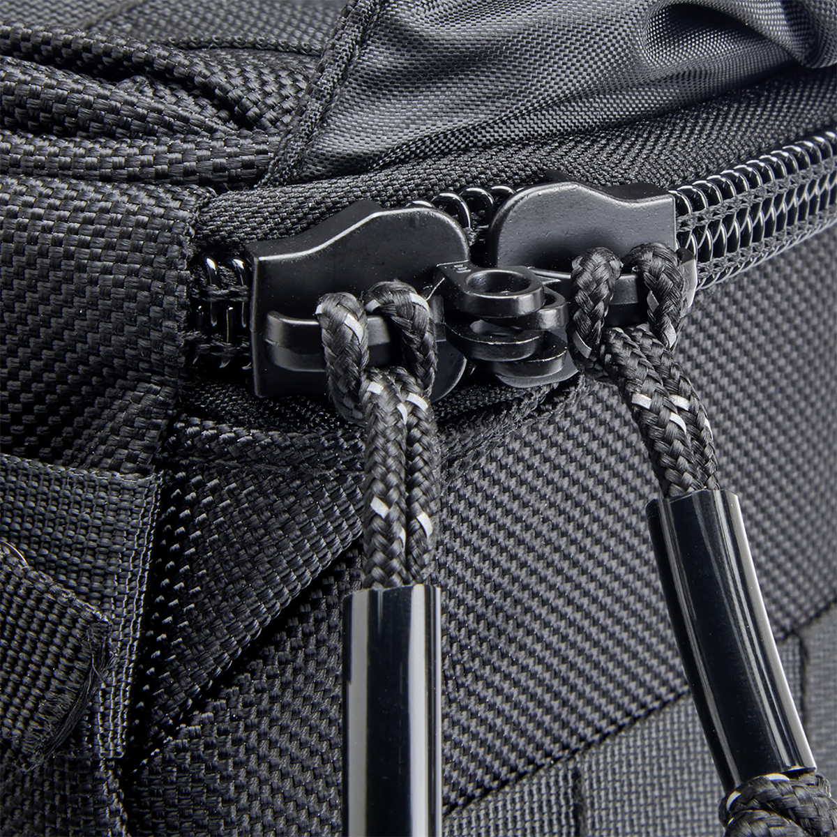 Black Biltwell Exfil-18 saddlebags attached to a motorcycle, showcasing durable leather bags with metal buckles for secure storage.