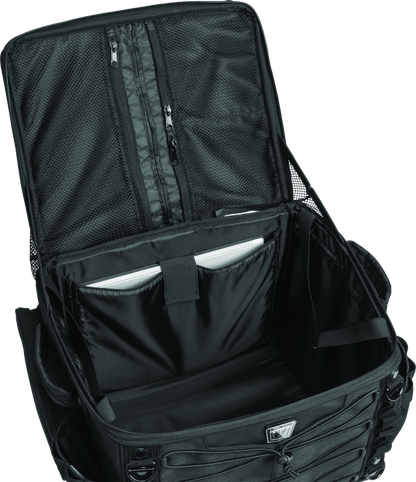 Kuryakyn Momentum Vagabond Bag attached to motorcycle seat and luggage rack for versatile storage and travel convenience.