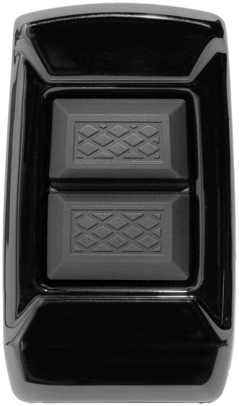 Kuryakyn Enygma brake pedal pad in gloss black for FL Touring models, showing textured rubber surface and mounting area.