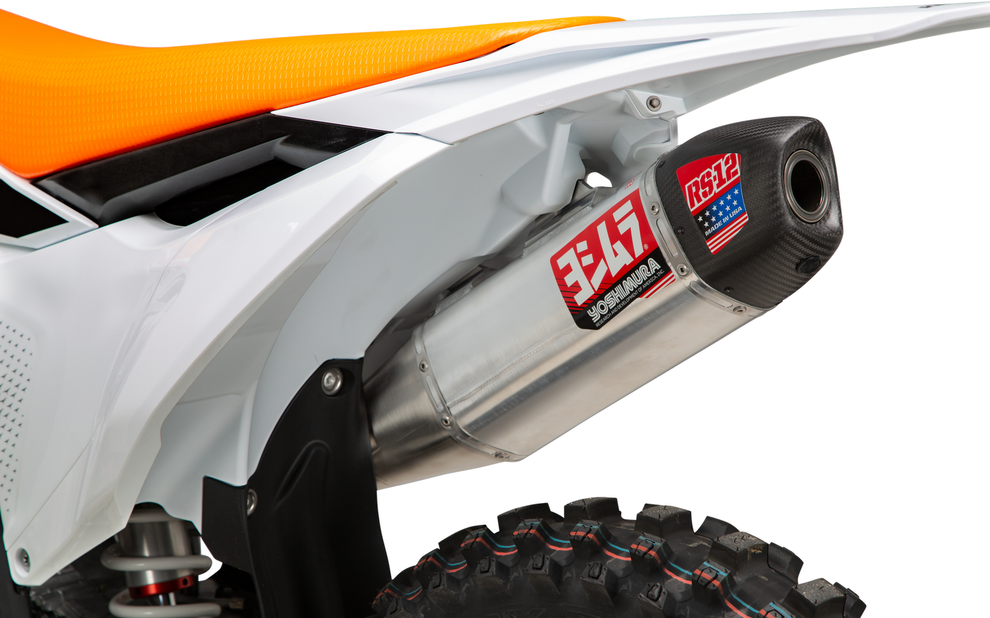 YOSHIMURA RS-12 slip-on exhaust installed on KTM and Husqvarna motorcycles, showcasing the sleek, metallic exhaust system.