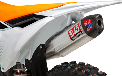 YOSHIMURA RS-12 slip-on exhaust installed on KTM and Husqvarna motorcycles, showcasing the sleek, metallic exhaust system.