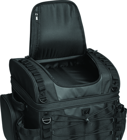 Kuryakyn Momentum Vagabond Bag attached to motorcycle seat and luggage rack for versatile storage and transport.