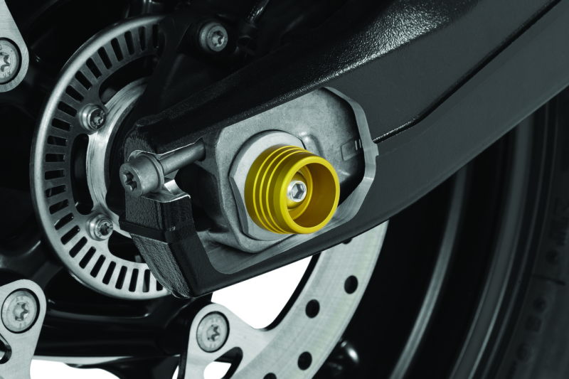 Kuryakyn Lodestar rear axle slider on BMW S1000RR motorcycle, protecting the rear axle and enhancing bike's look.