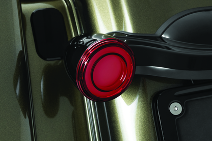 Kuryakyn Tracer LED rear turn signal insert for Harley Davidson Road King Special motorcycle, showing illuminated red LED lights.