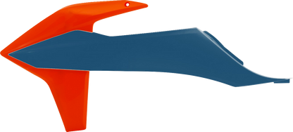 Acerbis radiator shrouds in orange and factory blue for motorcycle body protection, featuring vibrant color accents.