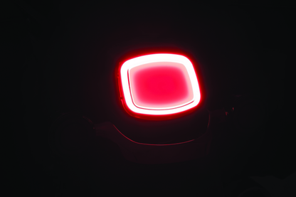 Kuryakyn Tracer LED Taillight with Smoke Lens for Harley Davidson motorcycle, showing sleek black smoked lens and LED lighting elements.