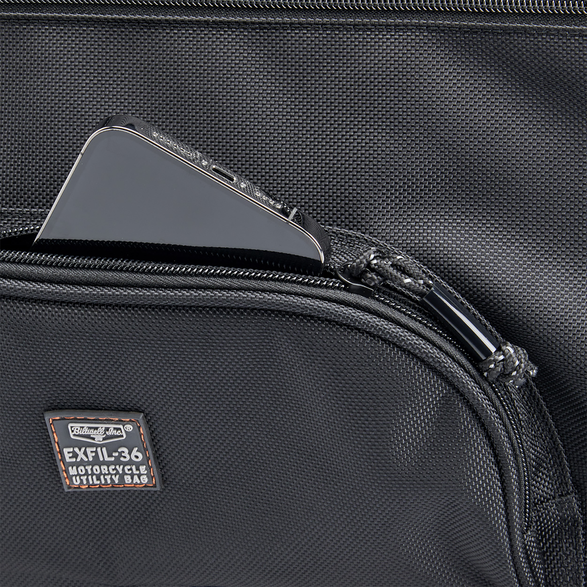 Black BILTWELL EXFIL-36 Saddlebags attached to a motorcycle, showcasing durable bag design and secure mounting for touring rides.