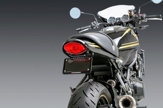 YOSHIMURA Yoshimura V2 Fender Eliminator Kit installed on a Kawasaki motorcycle, showcasing sleek design and mounting hardware.